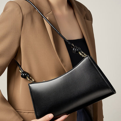 2025 Baguette underarm women's bag popular new summer high-end commuting shoulder bag textured leather bag