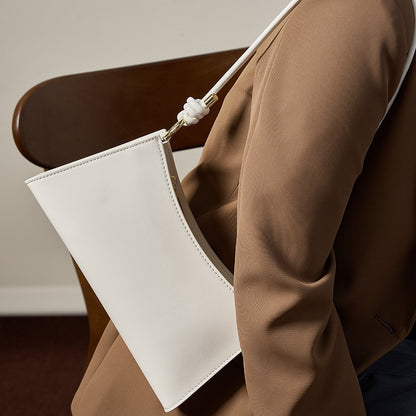 2025 Baguette underarm women's bag popular new summer high-end commuting shoulder bag textured leather bag